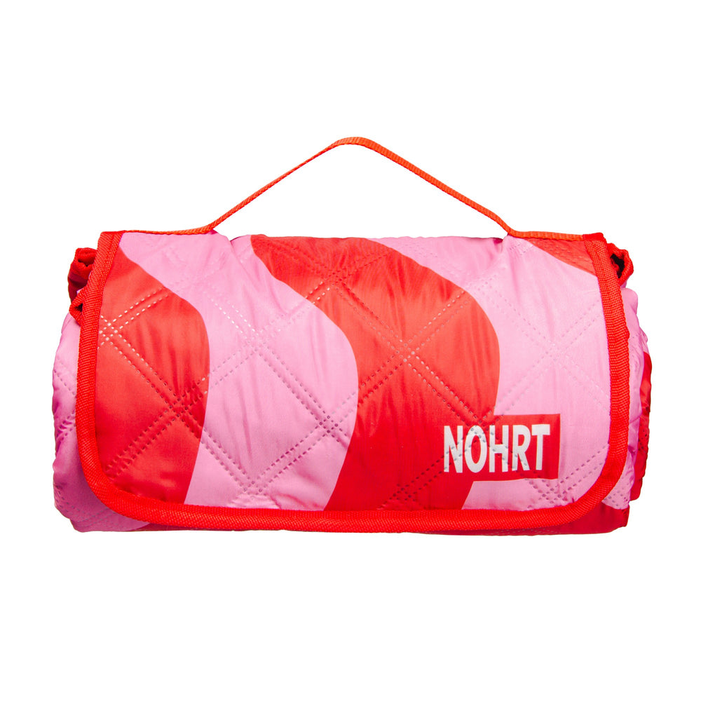 Rogue blanket folded for easy transport – stylish gear for outdoor freedom